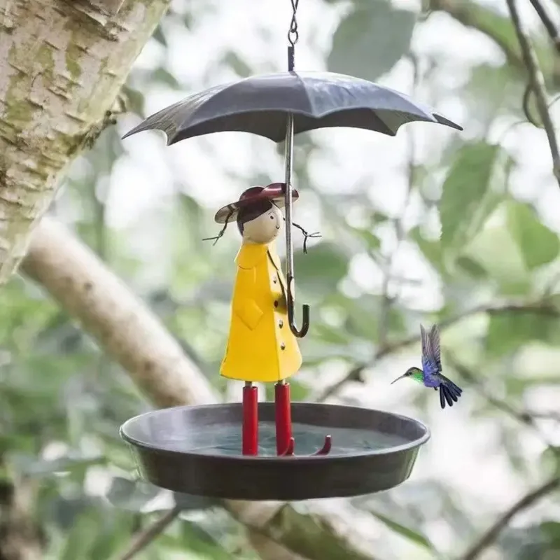 Artistic Raincoat Girl Bird Feeder - Image 0