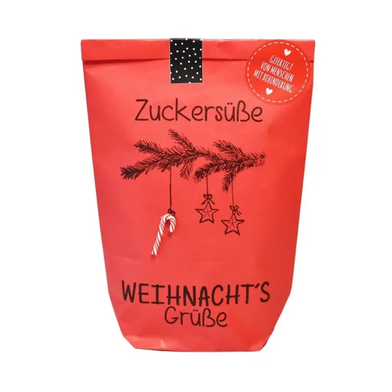 Rote Wundertüte mit einem aufgedruckten Tannenzweig an dem eine kleine Zuckerstange hängt mit der Schawrzen Schrift "Zuckersüße Weihnnachtsgrüße"